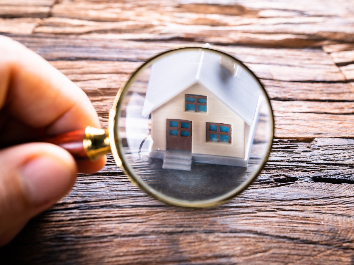 magnifying glass over house
